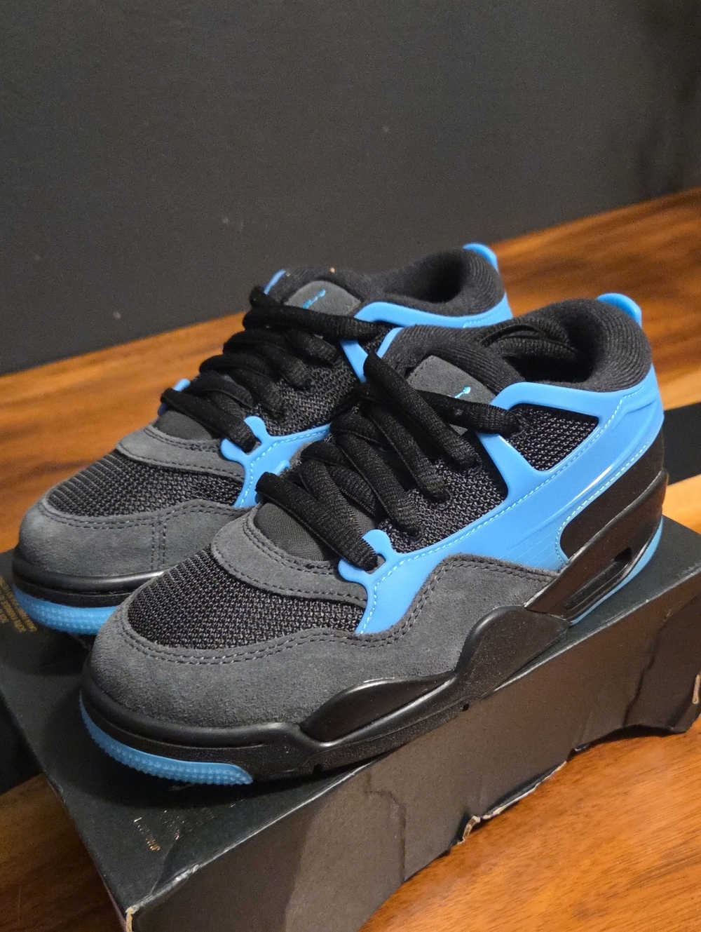 Air Jordans 4RM - Black and Gamma Blue Size 4 Youth